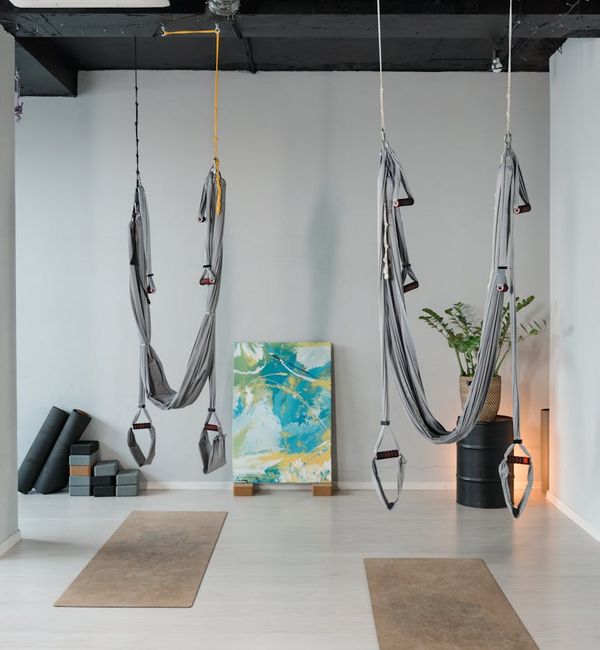 Person meditating peacefully in a bright, minimalist setting.